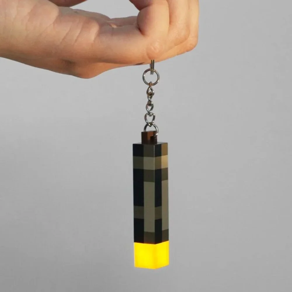 Pixel Torch Light Keychain – Battery Powered LED Mini Gadget for Fans!